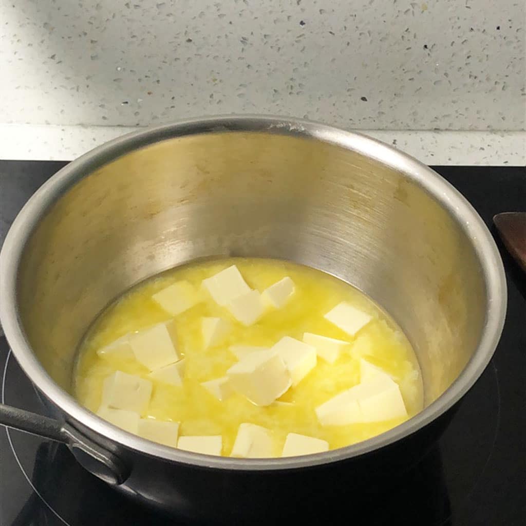 Cubes of butter melting in a saucepan