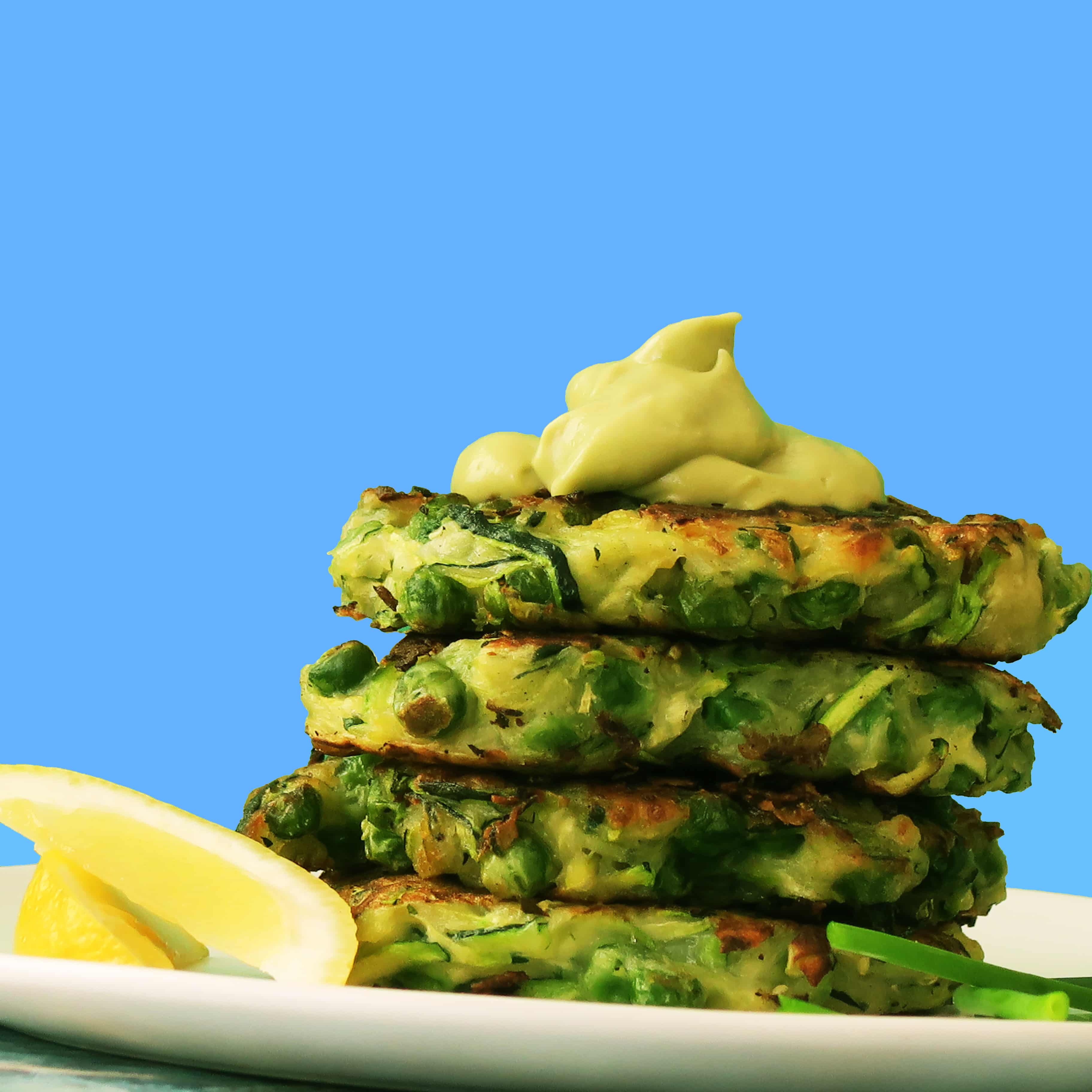 Zucchini and Green Pea Fritters with Avocado Crema {Vegan}