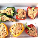Green, red, and yellow peppers, cut from stem to tip, and stuffed with rice, beans, tomatoes, and chipotle cheese sauce mix.
