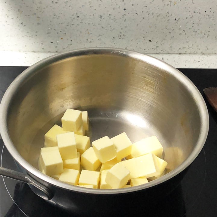 Making Brown Butter, cubed pieces of butter in a saucepan