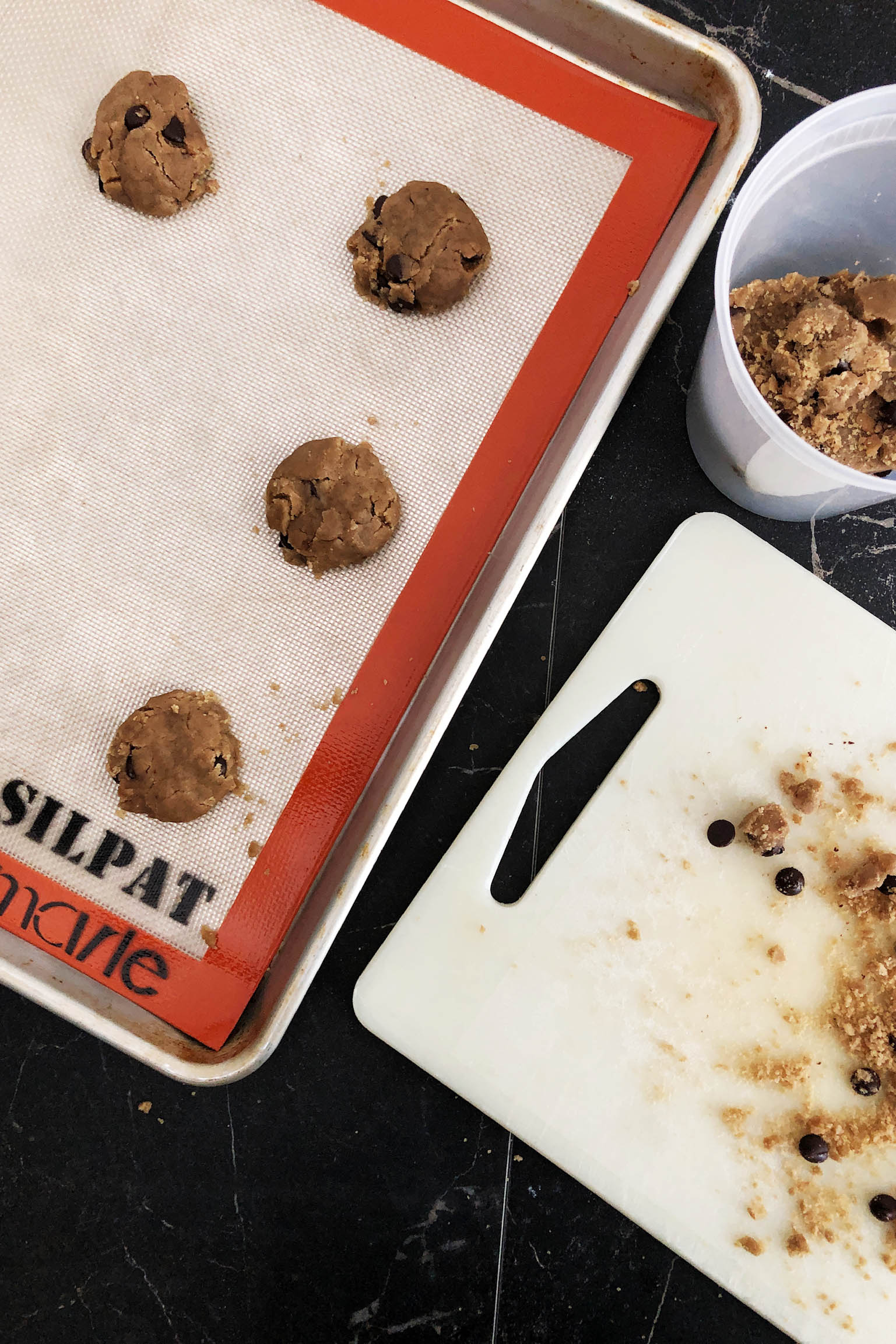 Top-down view of vegan brown butter chocolate chip cookies on a baking sheet