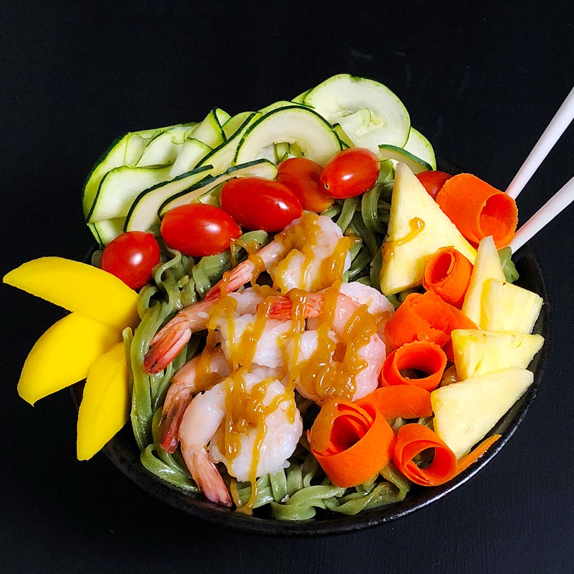Top-down view of Buddha Bowl with prawns and brown butter teriyaki sauce