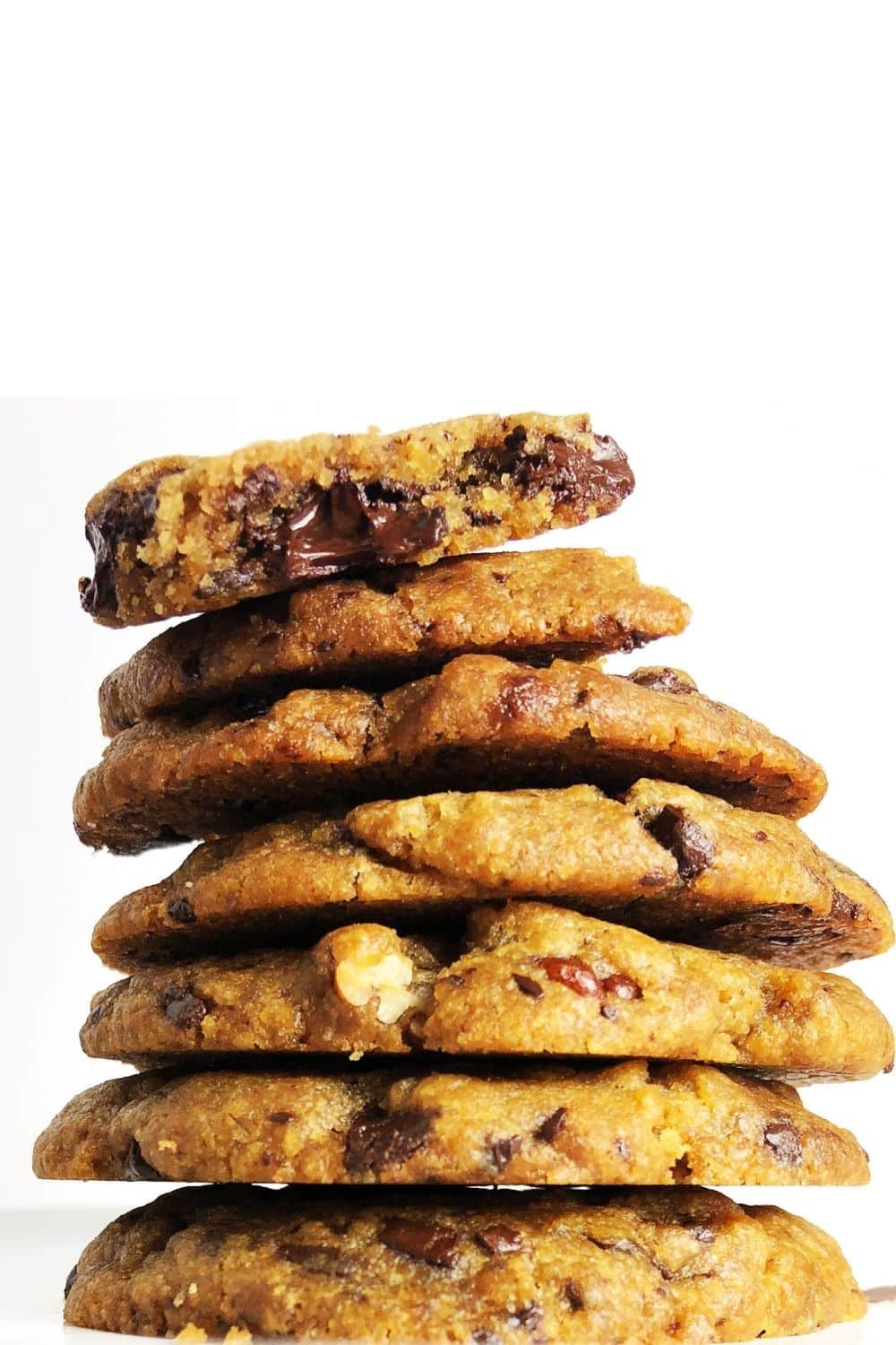 Stack of Vegan Brown Butter Chocolate Chip Cookies against a white background