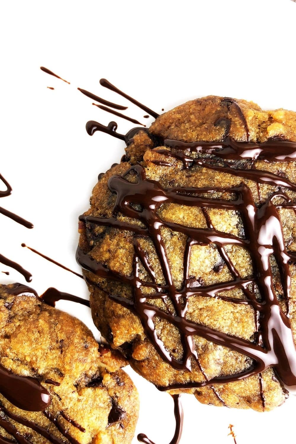 Top-down view of vegan brown butter chocolate chip cookies drizzled with extra chocolate