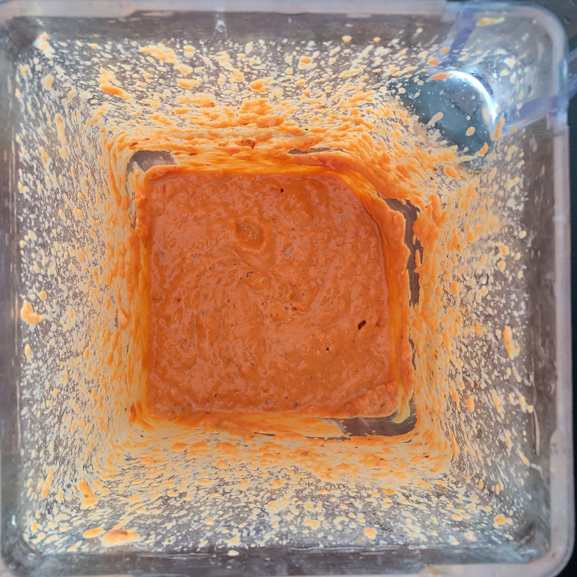 Top-down view of  Spicy Tomato Peanut Sauce in blender. 