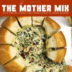 Pin for Warm Spinach Dip (Vegan) Made with the Mother Mix. Image includes top-down shot of Warm Spinach Dip oozing out of a bread bowl, on a baking sheet