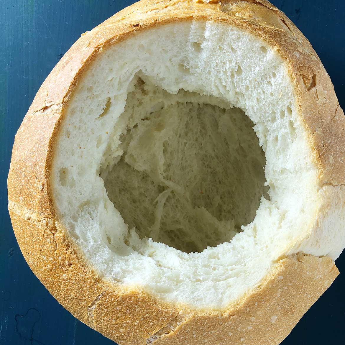 Top-down view of Bread Bowl, preparing for Hot Spinach Dip