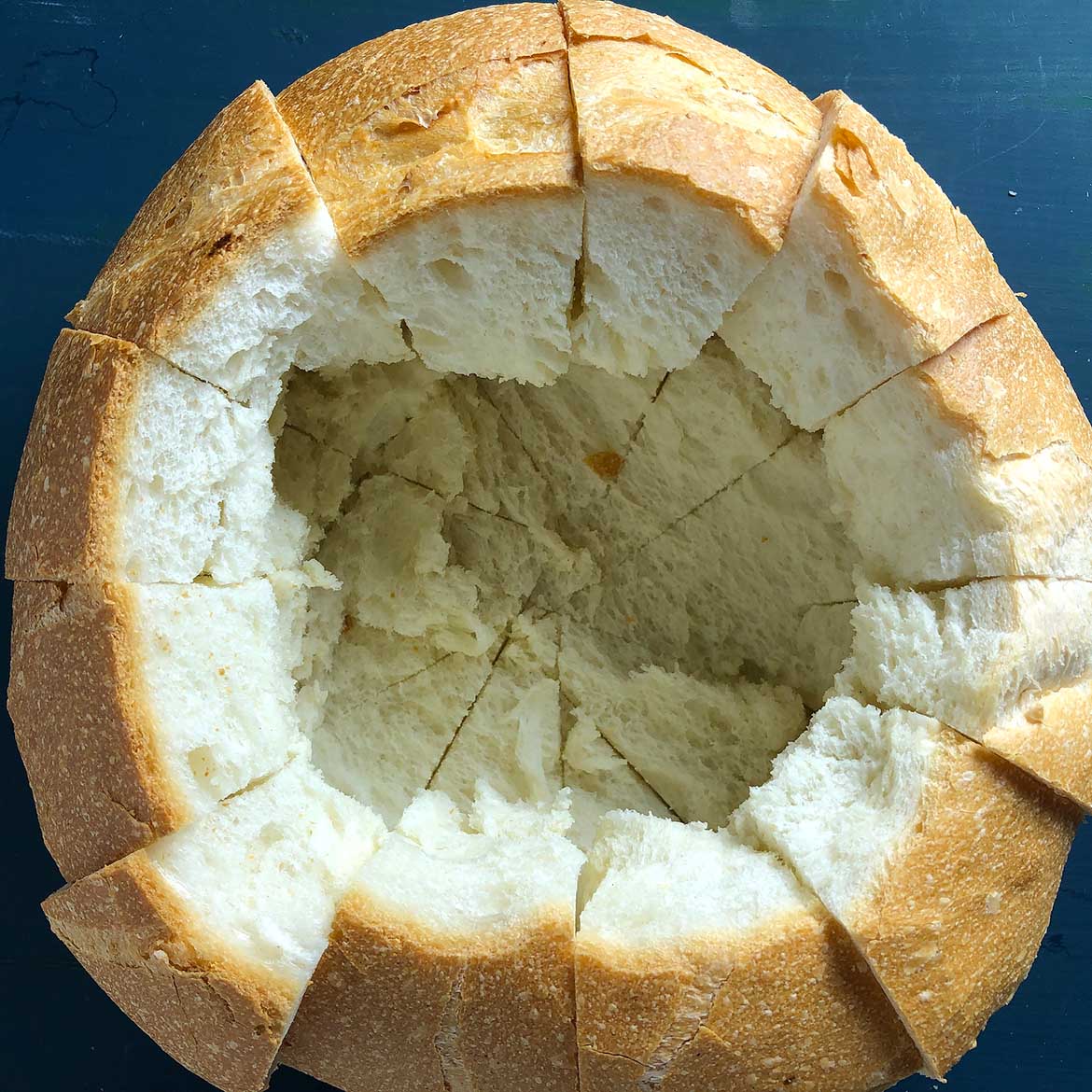Top-down view of Bread Bowl, preparing for Hot Spinach Dip