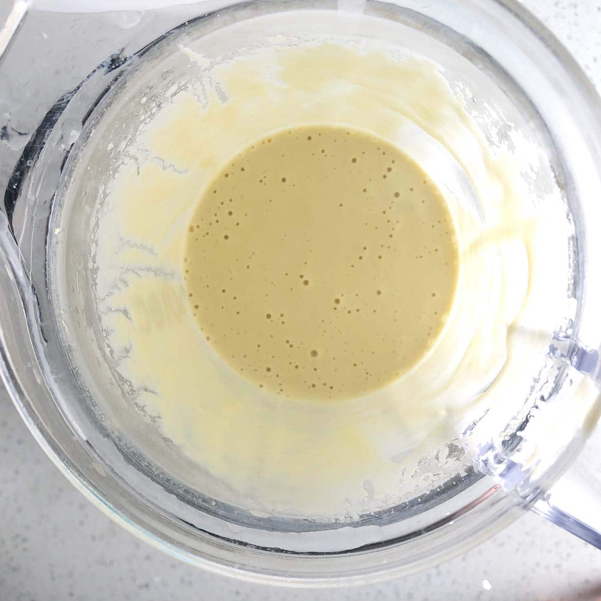 Top-down shot of mixed batter for Savoury Vegan Cheese Spread, in the blender