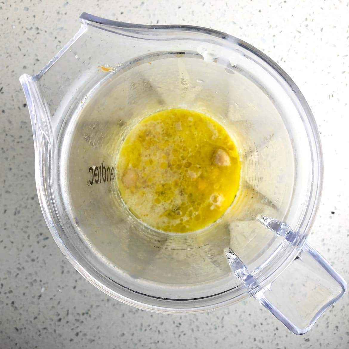 Top-down view of blender with ingredients for making Savoury Vegan Cheese Spread