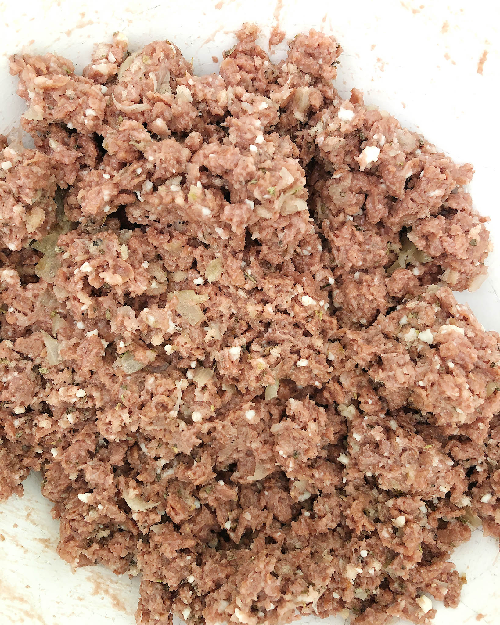 Top-down shot of finished mixture for Beyond Meat Meatballs - meat, spices, and breadcrumbs mixed together