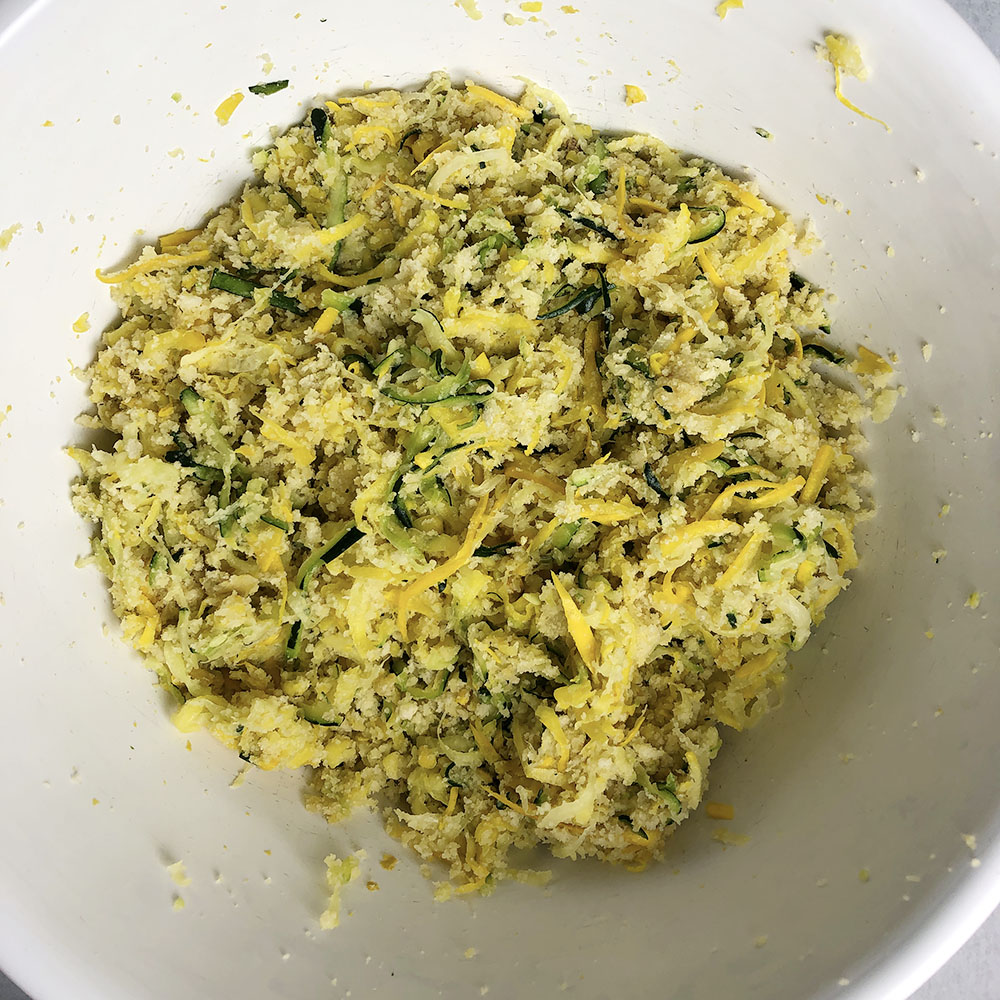 Zucchini fritter batter in a bowl