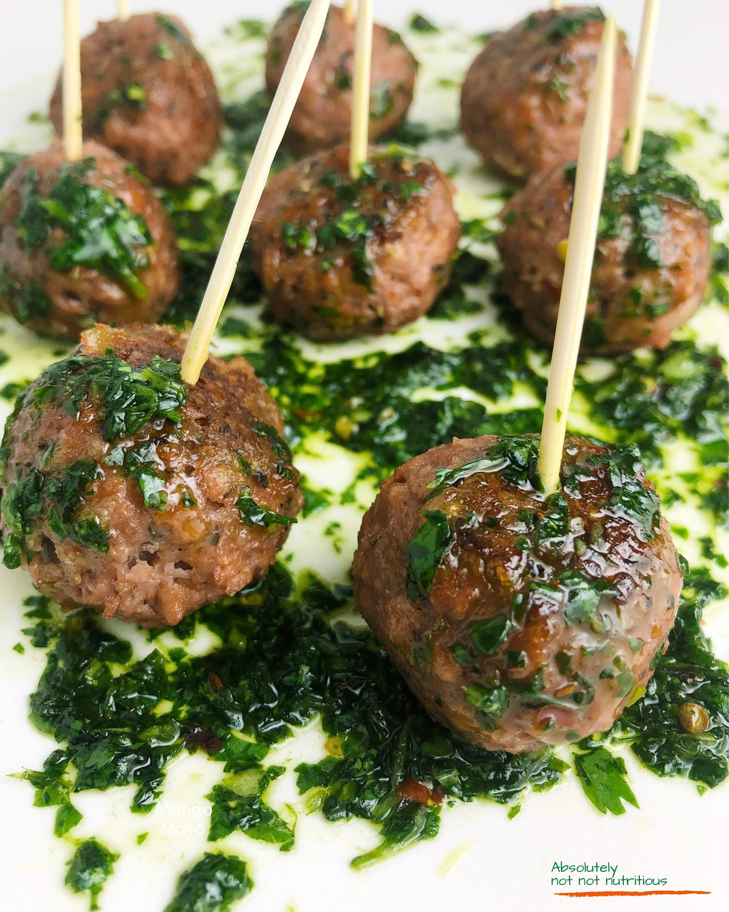 Close up view of mini Beyond Meat Meatballs with garlicky chimichurri