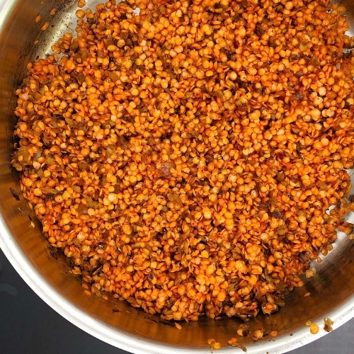 Add the red lentils to the seasoning mixture.