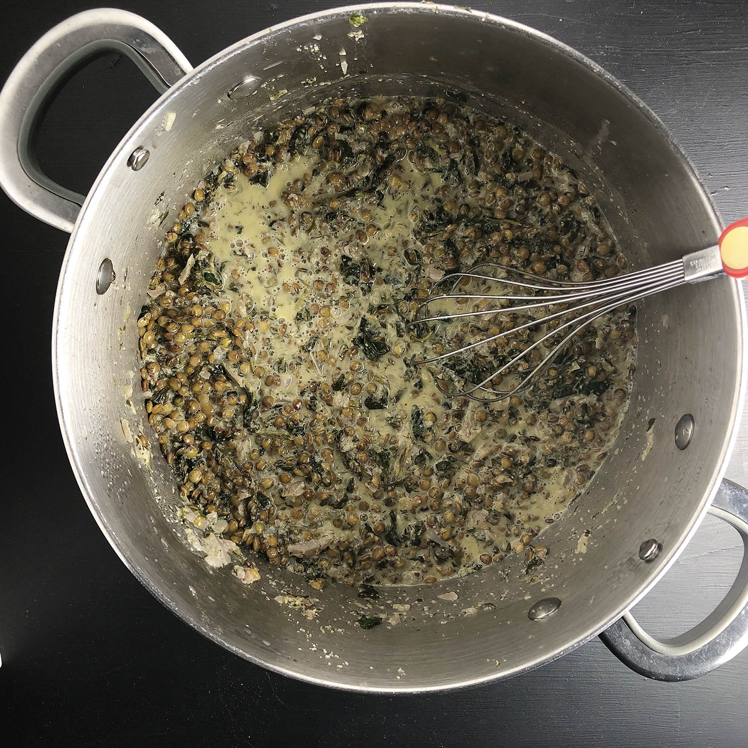 Making Lentil, Lemon, and Dill Soup. Whisk in egg mixture and heat through.