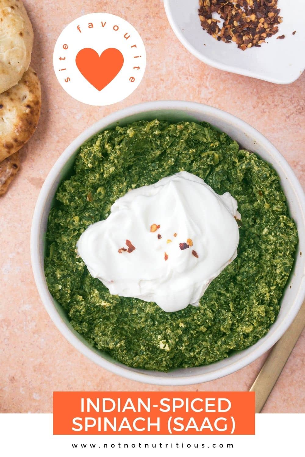 Top-down view of bowl of Indian-spiced spinach (saag), topped with extra yogurt