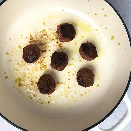 Top-down shot of pan-frying Beyond Meat Meatballs in a frying pan