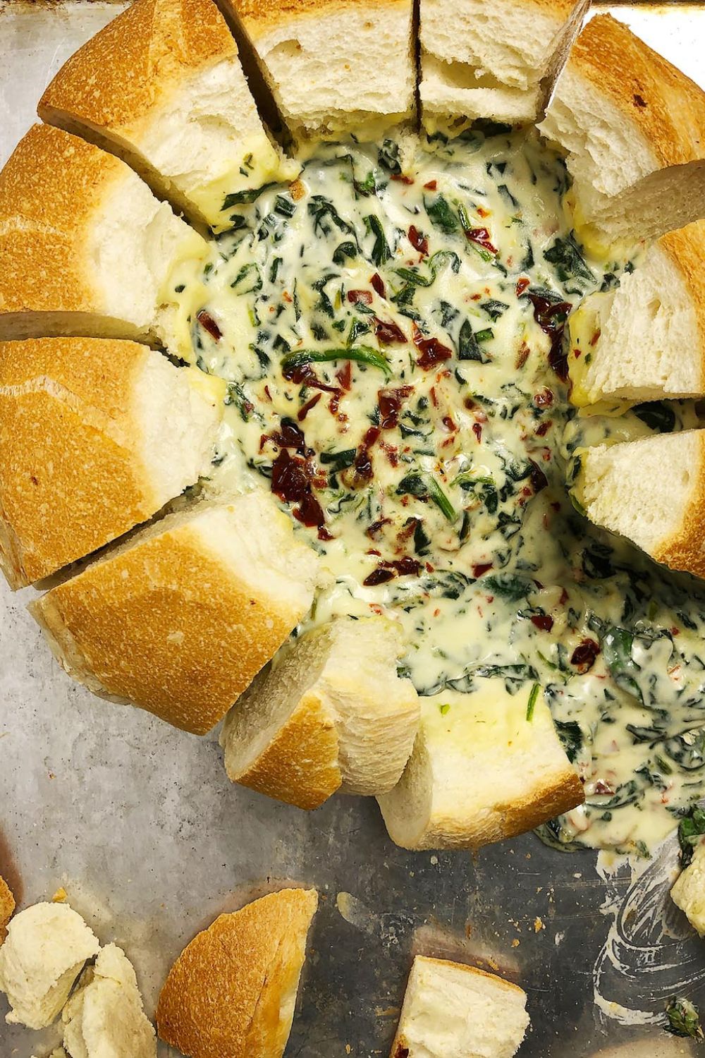 Top-down view of Hot Spinach dip in a bread bowl