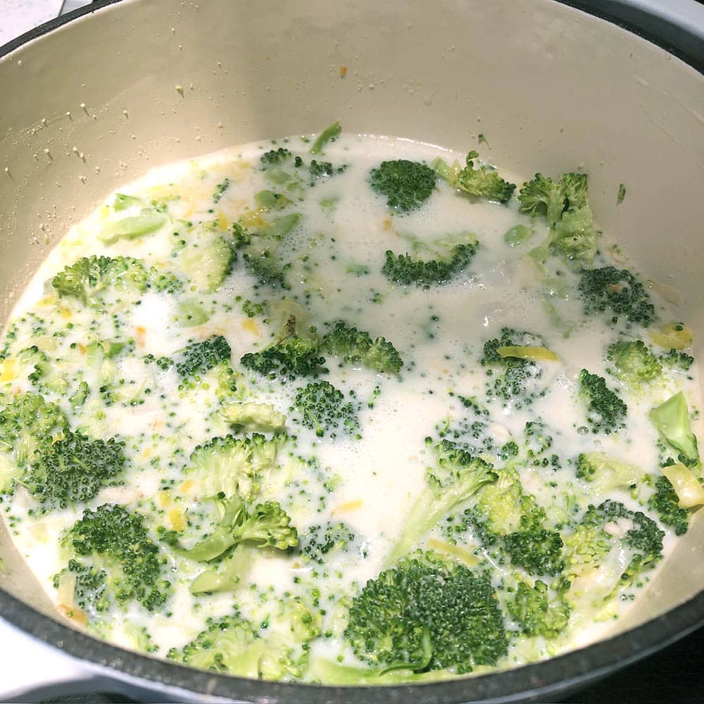 Top-down view of Lemony Leek and Broccoli Soup at a low boil