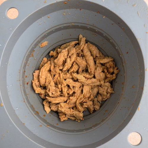 Top-down view of soy curls in a colander
