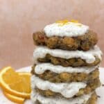 Stack of Chickpea Fritters dripping with Minty Yogurt Sauce